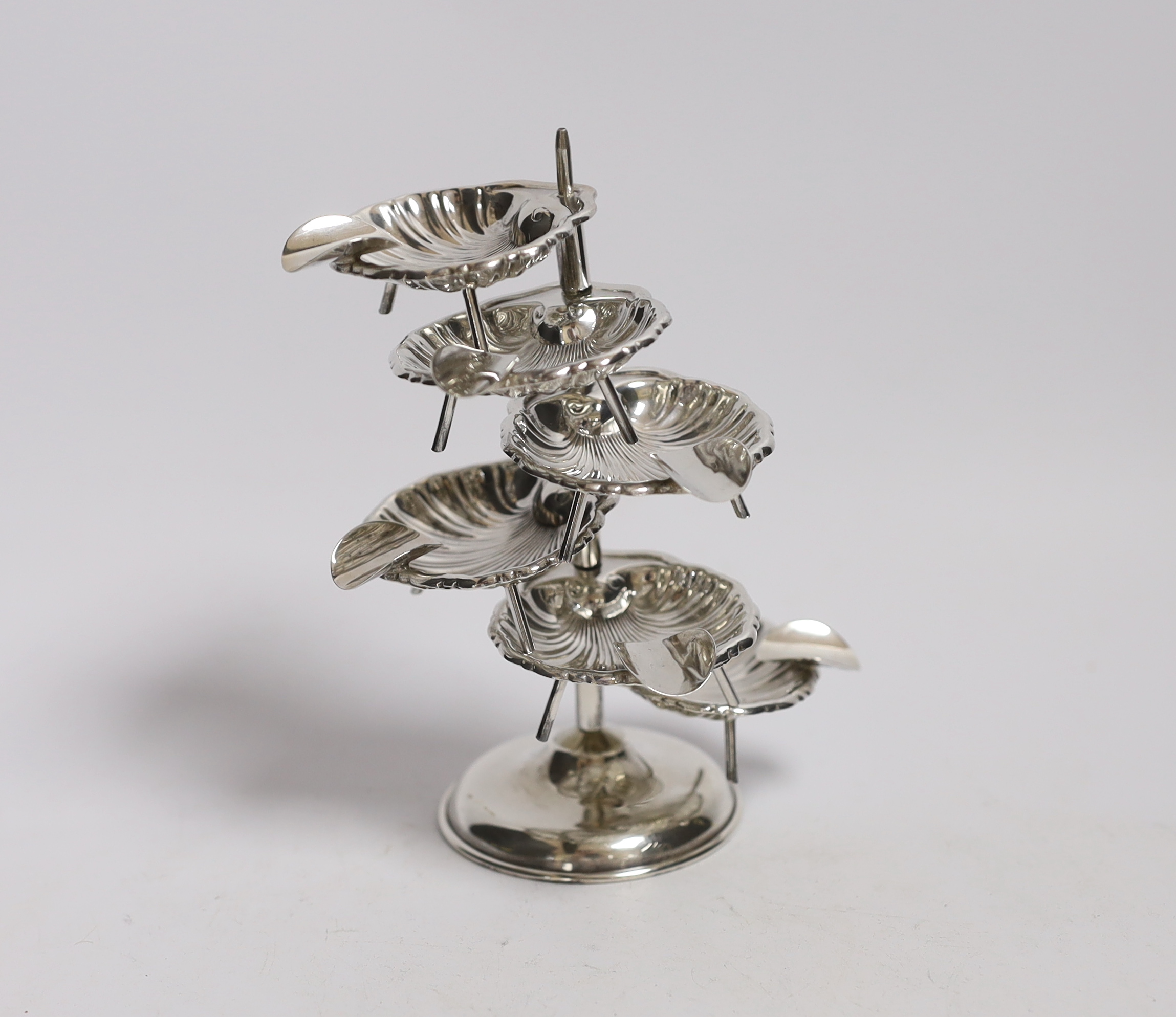 A Mexican 925 sterling ashtray stand, with six detachable shell shaped 925 sterling ashtrays, overall height 14.2cm, 3.8 oz.